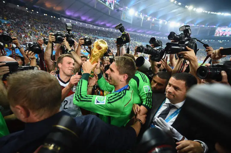 Ron-Robert Zieler of Germany celebrates with the World Cup trophy after defeating Argentina.