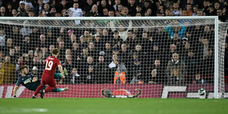 Harvey Elliott scores the winning penalty for Liverpool vs Derby County. (Photo by OLI SCARFF/AFP via Getty Images)