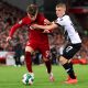 Ben Doak of Liverpool is challenged by Louie Sibley of Derby County during the Carabao Cup Third Round match between Liverpool and Derby County at Anfield on November 09, 2022 in Liverpool, England