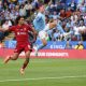 Phil Foden of Manchester City kicks the ball under pressure from Trent Alexander-Arnold of Liverpool. (