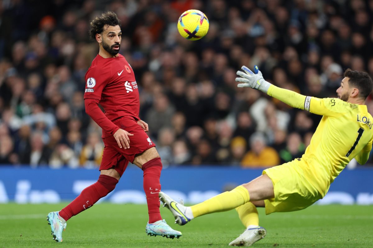 Liverpool's Mohamed Salah chipping the ball over Hugo Lloris to give the Reds their second goal.