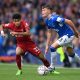 Nathan Patterson of Everton is challenged by Luis Diaz of Liverpool.