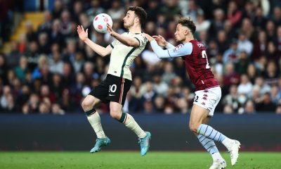 Diogo Jota of Liverpool is challenged by Matty Cash of Aston Villa during a Premier League game in May 2022.