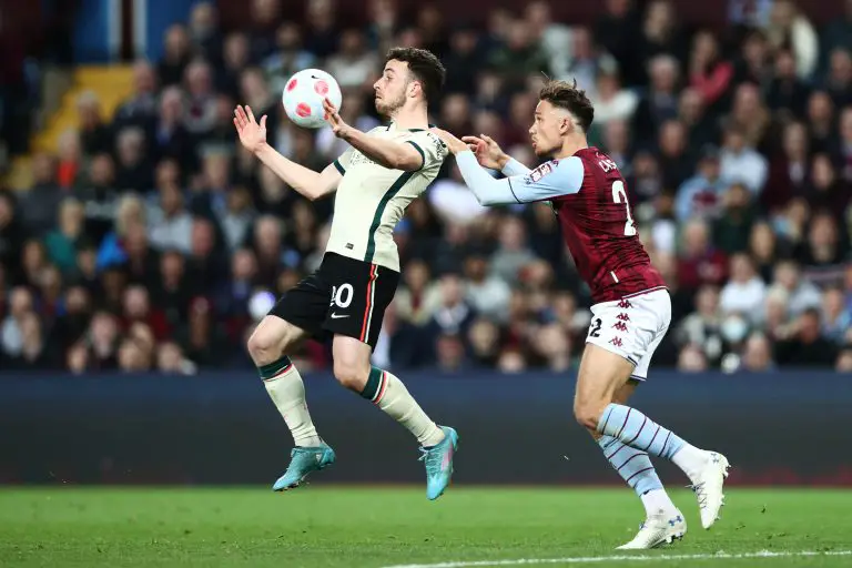 Diogo Jota of Liverpool is challenged by Matty Cash of Aston Villa during a Premier League game in May 2022.