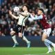 Diogo Jota of Liverpool is challenged by Matty Cash of Aston Villa during a Premier League game in May 2022.