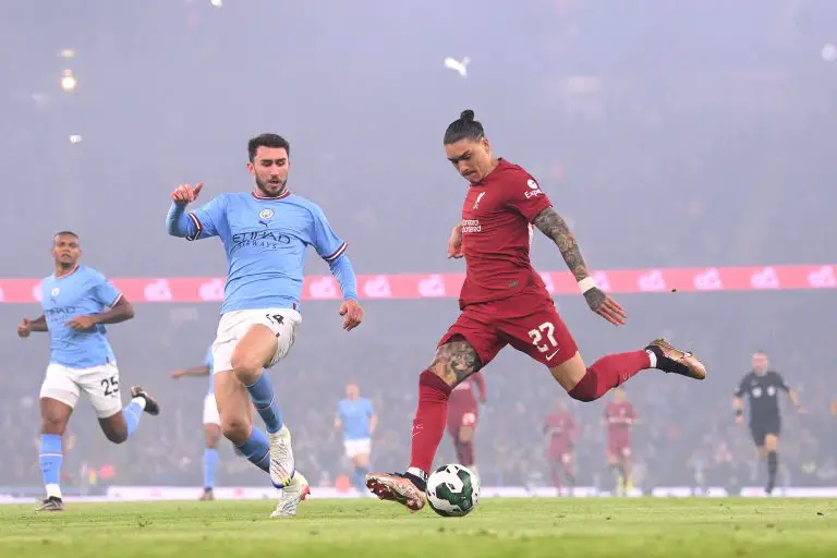 Darwin Nunez battles Aymeric Laporte for possession during Liverpool vs Manchester City in the Carabao Cup, 2022