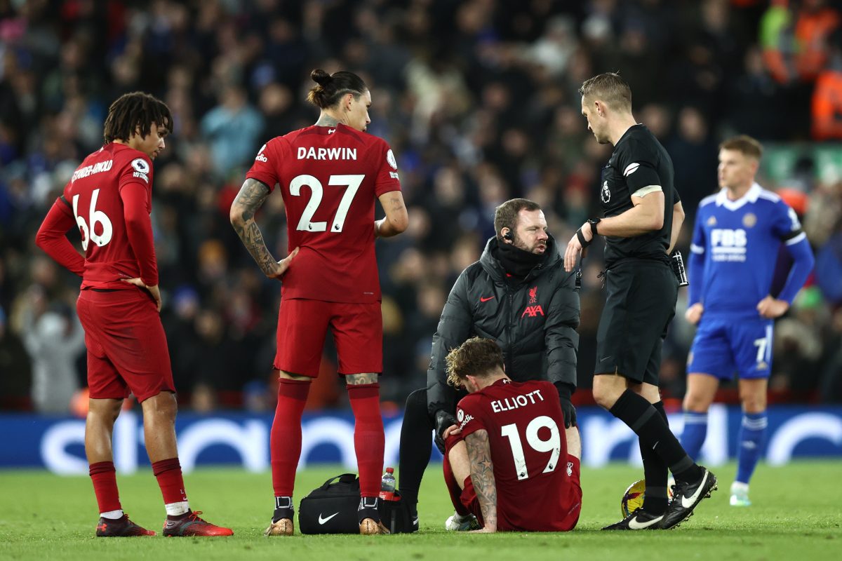 Harvey Elliott of Liverpool received medical attention against Leicester City as Trent Alexander-Arnold and Darwin Nunez watch on. 