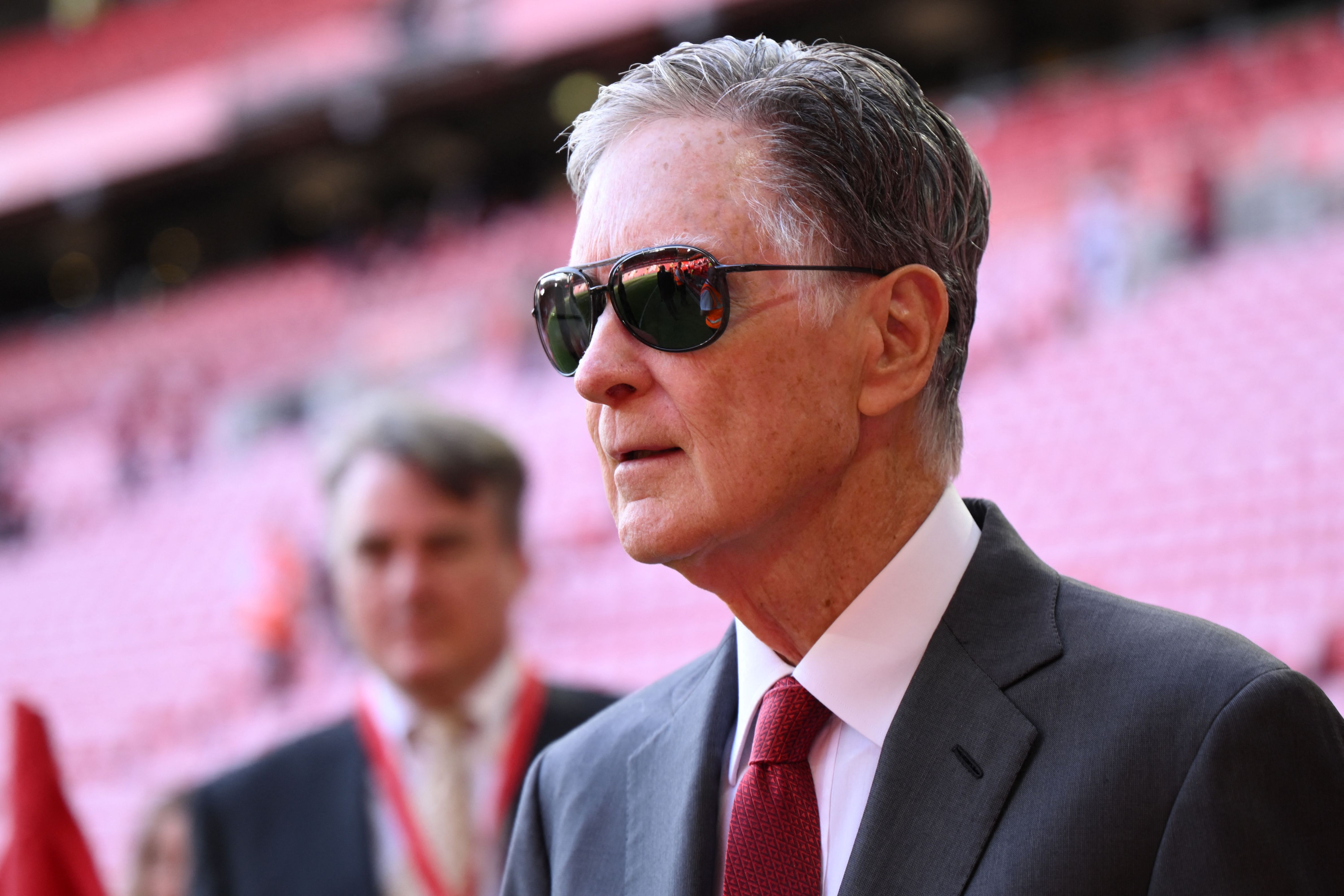 Liverpool's US owner John W. Henry could sell the club in the near future. (Photo by OLI SCARFF/AFP via Getty Images)