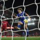 Wout Faes scores an own goal during Liverpool vs Leicester City in December 2022. (Photo by OLI SCARFF/AFP via Getty Images)