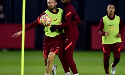 Nathaniel Phillips and Divock Origi of Liverpool during a training session.