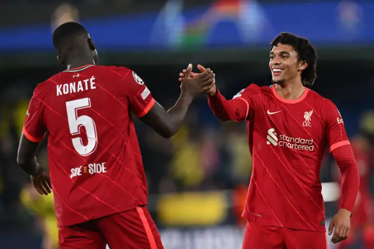 Trent Alexander-Arnold of Liverpool with Ibrahima Konate. (Photo by PAUL ELLIS/AFP via Getty Images)