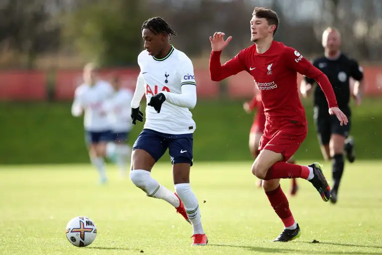 Romaine Mundle of Tottenham Hotspur U21 runs away from Calvin Ramsey of Liverpool U21.