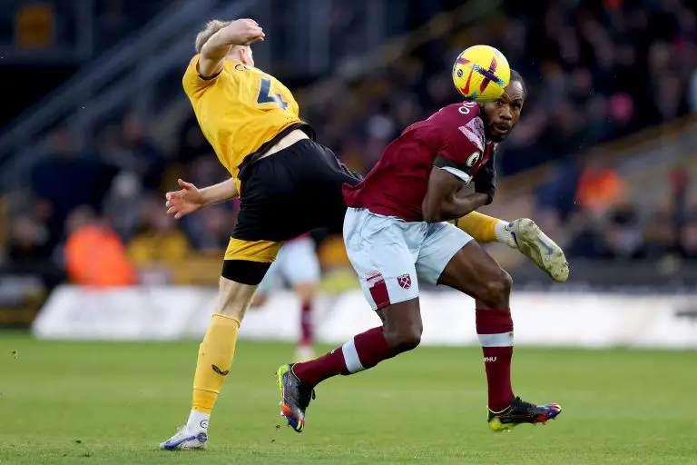 Michail Antonio of West Ham United battles for possession with Nathan Collins of Wolverhampton Wanderers.