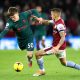 Ben Doak of Liverpool is tackled by Lucas Digne of Aston Villa.