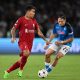 Roberto Firmino of Liverpool is put under pressure by Piotr Zielinski of SSC Napoli.