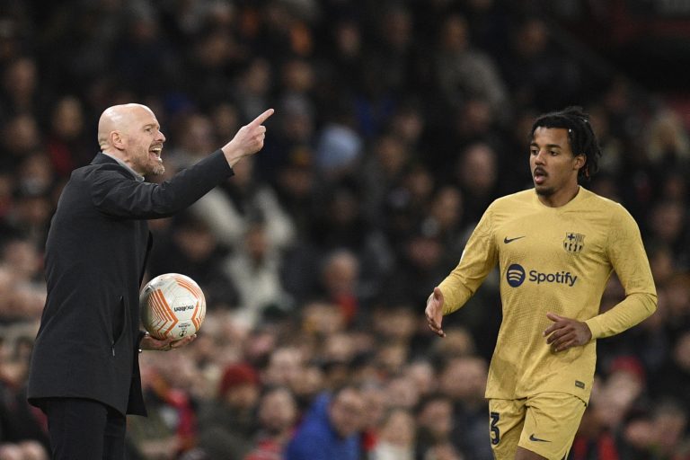 Manchester United's Dutch manager Erik ten Hag alongside Barcelona's Jules Kounde.