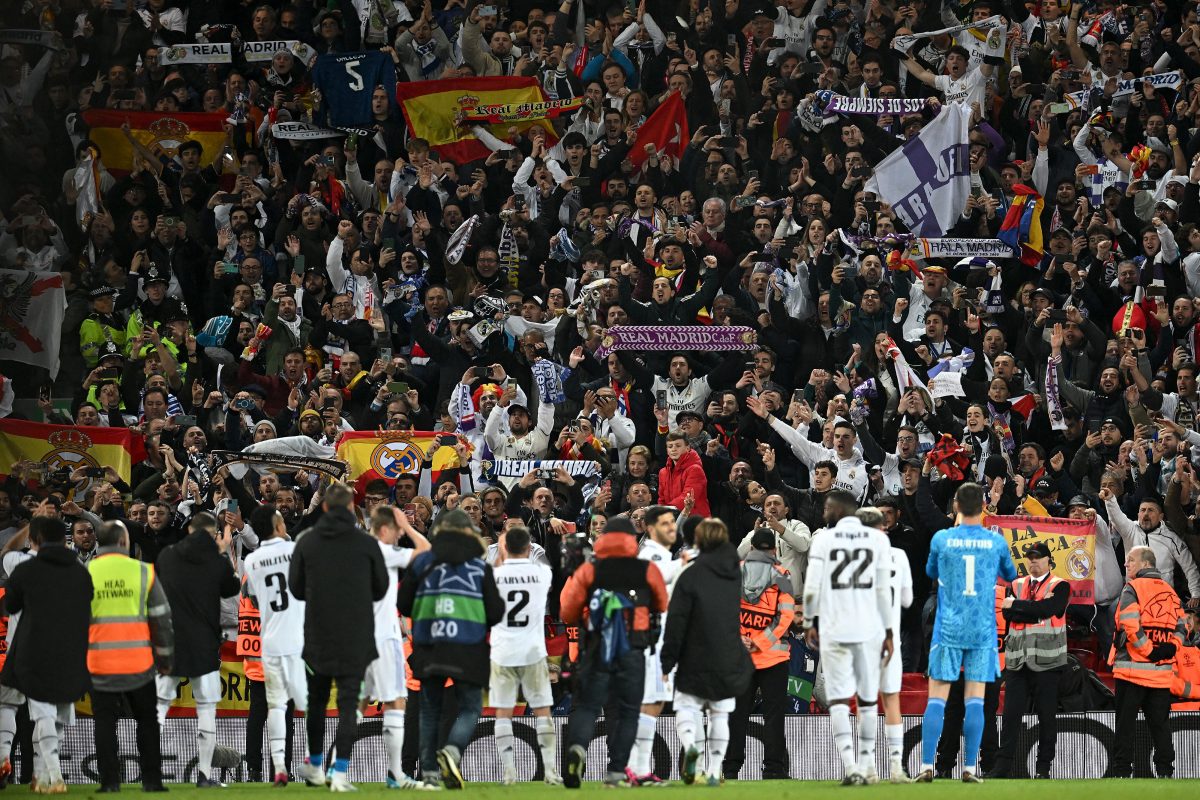Real madrid players applaud their fans following their 5-2 win against Liverpool at Anfield.