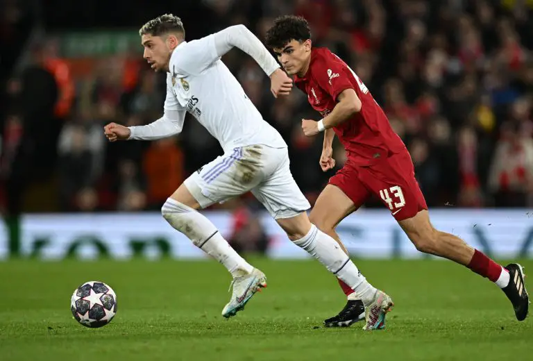 Liverpool's Spanish defender Stefan Bajcetic vies with Real Madrid's Uruguayan midfielder Federico Valverd. (Photo by PAUL ELLIS/AFP via Getty Images)