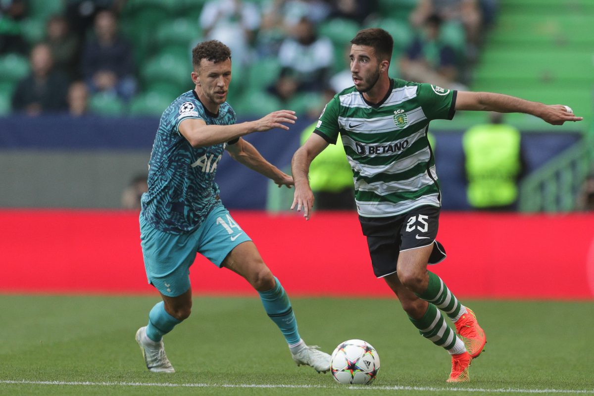 Tottenham Hotspur's Croatian midfielder Ivan Perisic fights for the ball with Sporting Lisbon's Portuguese defender Goncalo Inacio.