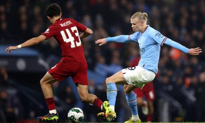 Erling Haaland of Manchester City holds off pressure from Stefan Bajcetic of Liverpool.