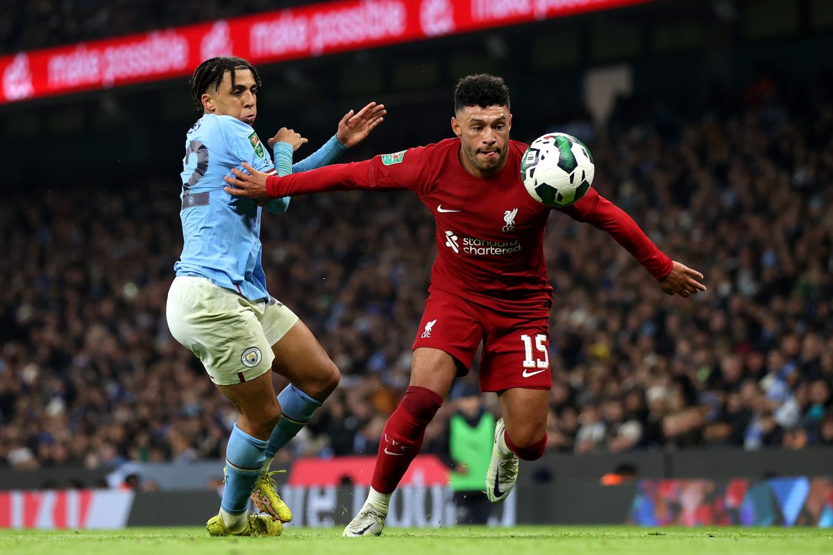 MANCHESTER, ENGLAND - DECEMBER 22: Alex Oxlade-Chamberlain of Liverpool holds off pressure from Rico Lewis of Manchester City during the Carabao Cup Fourth Round match between Manchester City and Liverpool at Etihad Stadium on December 22, 2022 in Manchester, England. 