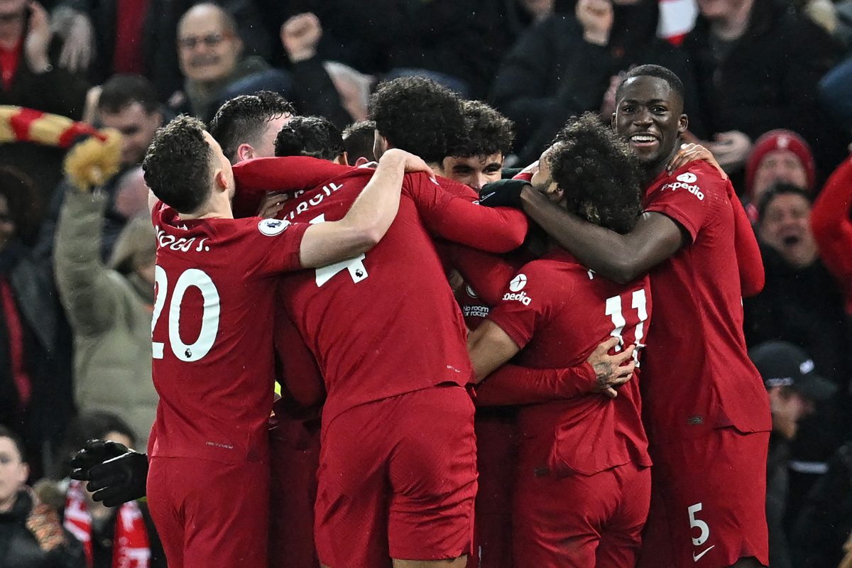 Liverpool's Brazilian striker Roberto Firmino celebrates with teammates after scoring against Manchester United.  