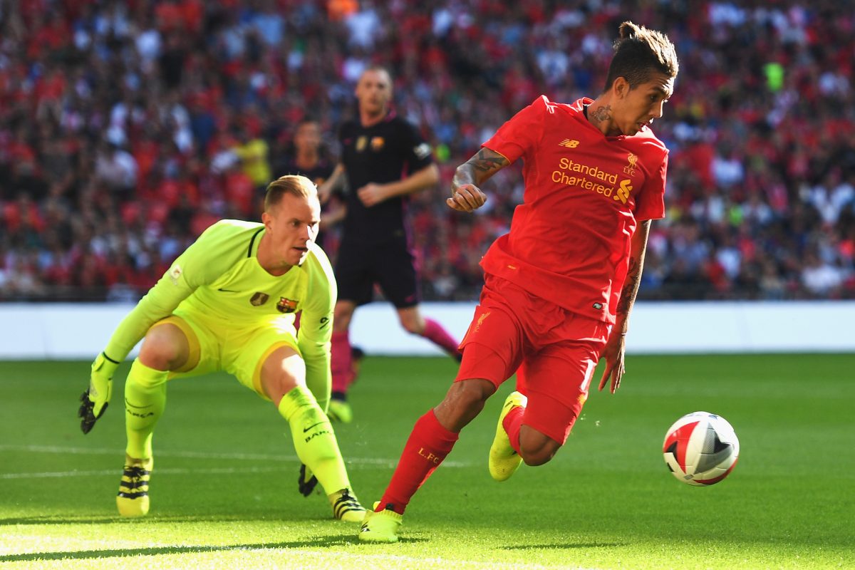 Roberto Firmino of Liverpool takes on Marc-Andre ter Stegen of Barcelona - August 2016.