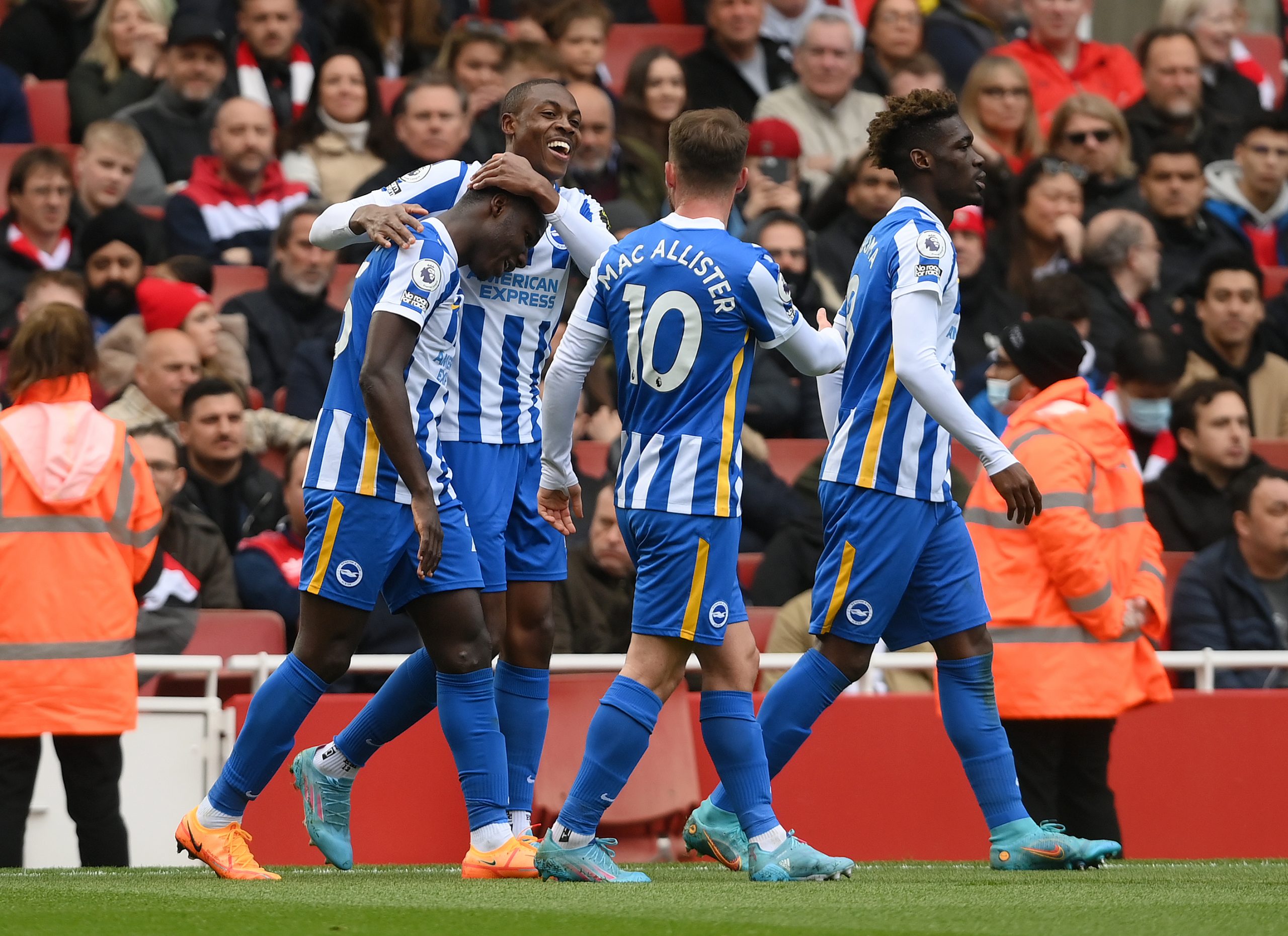 Enock Mwepu celebrates with teammate Moises Caicedo and Alexis Mac Allister of Brighton.