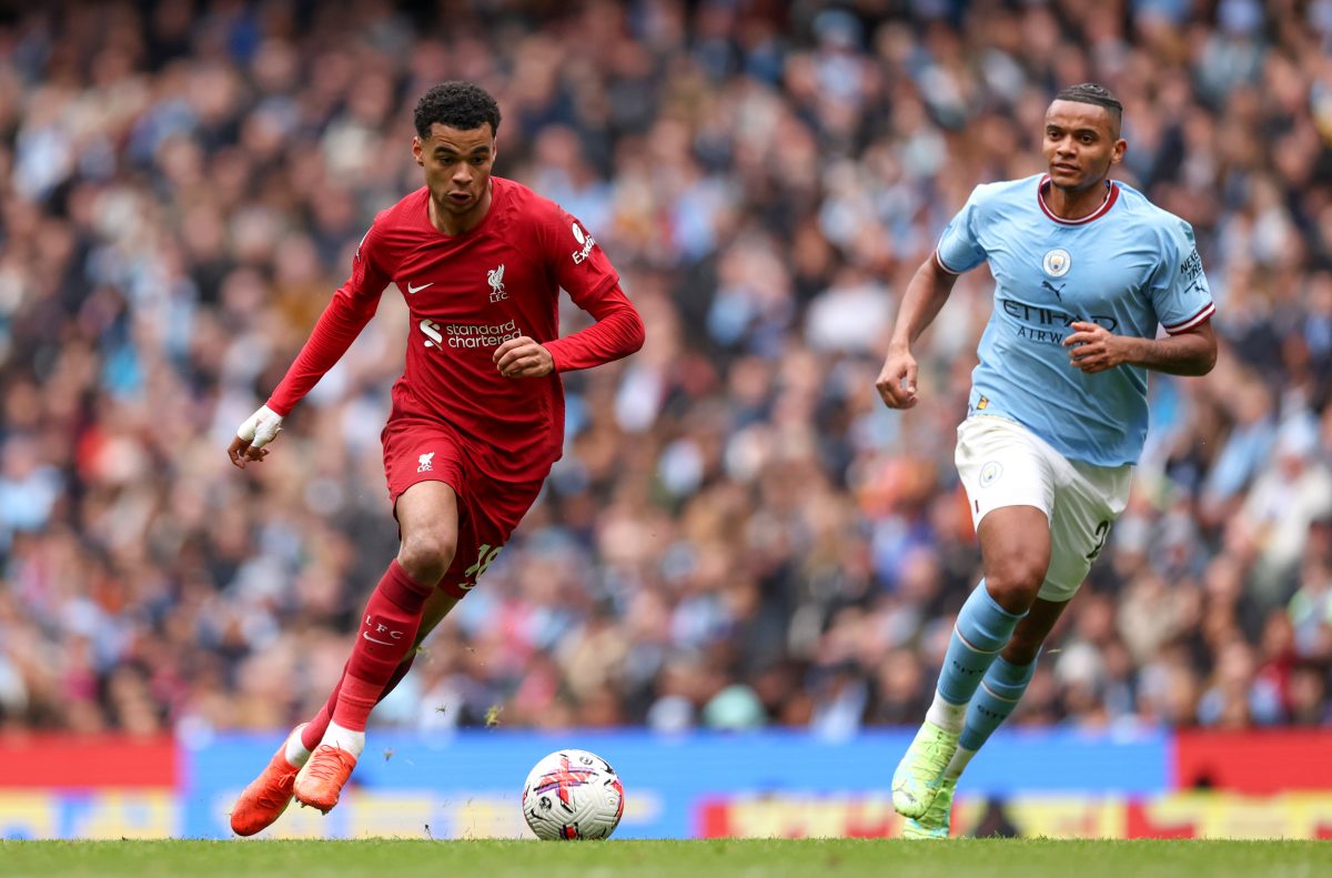 Cody Gakpo of Liverpool runs with the ball from Manuel Akanji of Manchester City.