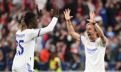 Real Madrid's Angolan midfielder Eduardo Camavinga celebrates with Luka Modric.