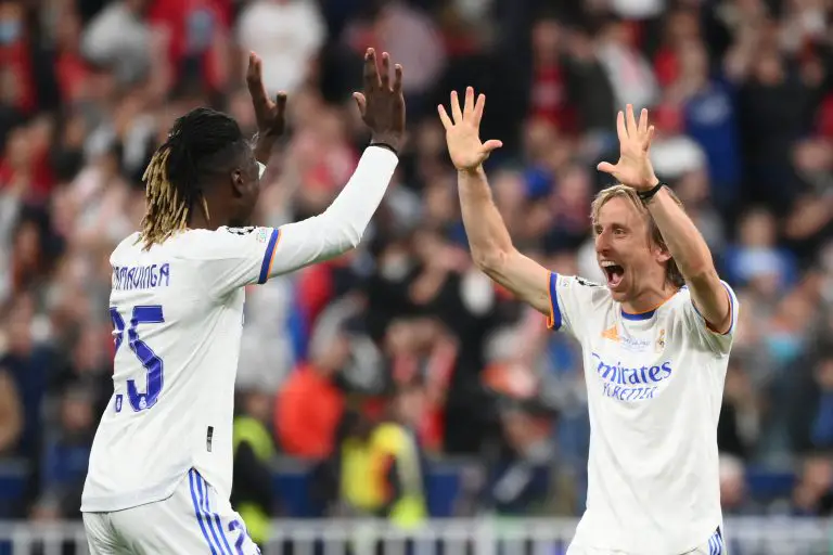 Real Madrid's Angolan midfielder Eduardo Camavinga celebrates with Luka Modric.