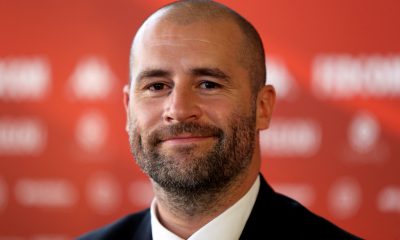 Monaco's Sporting Director Paul Mitchell smiles as he attends a press conference.
