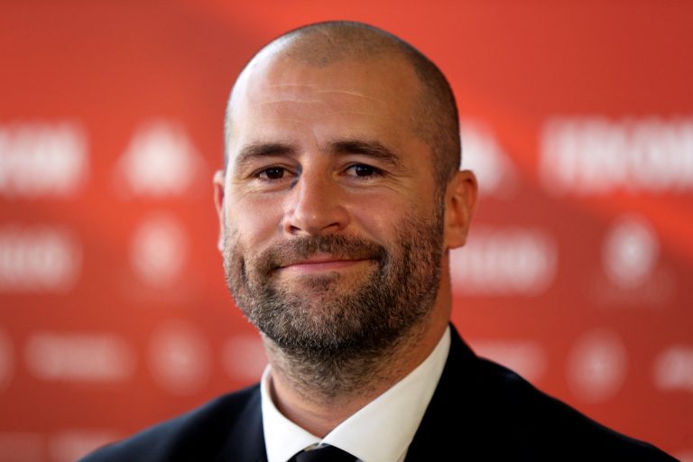 Monaco's Sporting Director Paul Mitchell smiles as he attends a press conference.