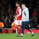 William Saliba of Arsenal leaves the pitch after picking up an injury.