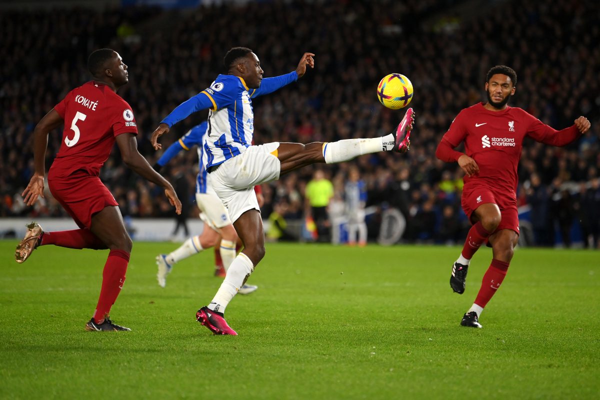 BRIGHTON, ENGLAND - JANUARY 14: Danny Welbeck of Brighton & Hove Albion controls the ball while under pressure from Ibrahima Konate and Joe Gomez of Liverpool during the Premier League match between Brighton & Hove Albion and Liverpool FC at American Express Community Stadium on January 14, 2023 in Brighton, England.