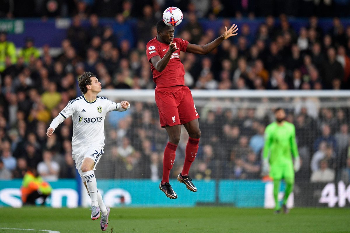 Liverpool's French defender Ibrahima Konate (C) wins a header as Leeds United's US midfielder Brenden Aaronson (L) looks on during the English Premier League football match between Leeds United and Liverpool at Elland Road in Leeds, northern England on April 17, 2023