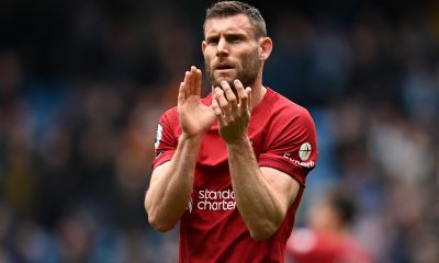 Liverpool's English midfielder James Milner applauds fans.