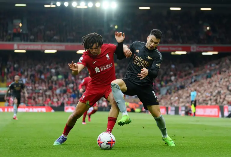 Trent Alexander-Arnold of Liverpool challenges Gabriel Martinelli of Arsenal.