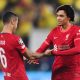 Thiago Alcantara and Trent Alexander-Arnold of Liverpool shake hands.
