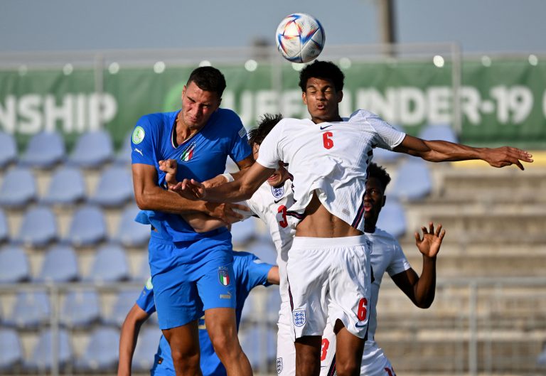 England's defender Jarell Quansah and Italy's defender Diego Coppola both jump to head the ball.