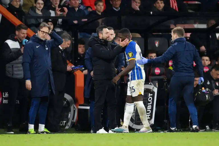 Moises Caicedo of Brighton is substituted after sustaining an injury and is embraced by Manager Roberto De Zerbi.