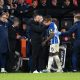 Moises Caicedo of Brighton is substituted after sustaining an injury and is embraced by Manager Roberto De Zerbi.