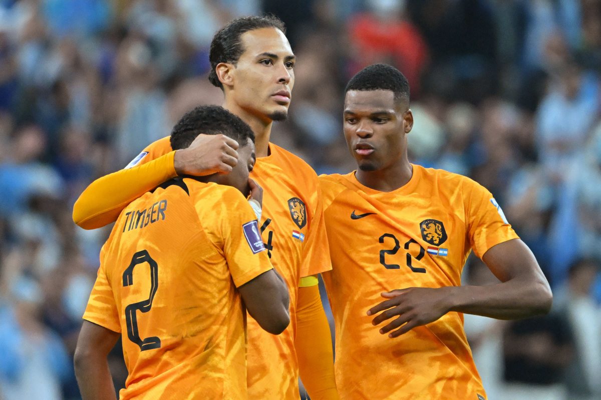 Netherlands' defenders Jurrien Timber, Virgil van Dijk and Denzel Dumfries comfort each other after losing to Argentina. 