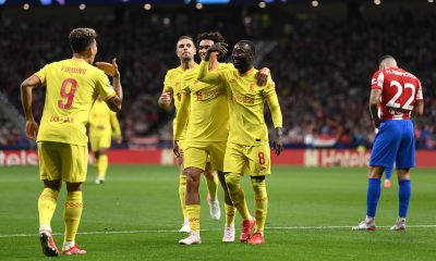 Naby Keita of Liverpool celebrates with Trent Alexander-Arnold and Roberto Firmino after scoring.