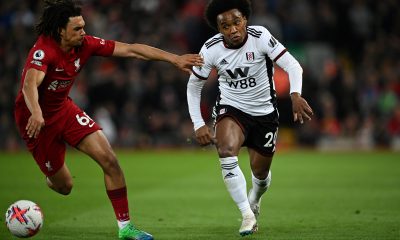 Liverpool's English defender Trent Alexander-Arnold (L) fights for the ball with Fulham's Brazilian midfielder Willian.
