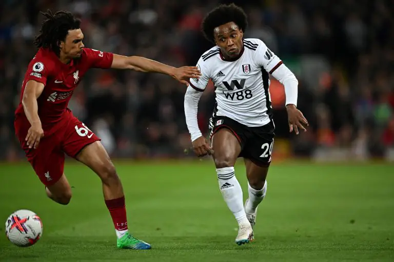 Liverpool's English defender Trent Alexander-Arnold (L) fights for the ball with Fulham's Brazilian midfielder Willian.