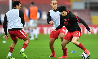 Curtis Jones, Thiago and Trent Alexander-Arnold of Liverpool warm up.