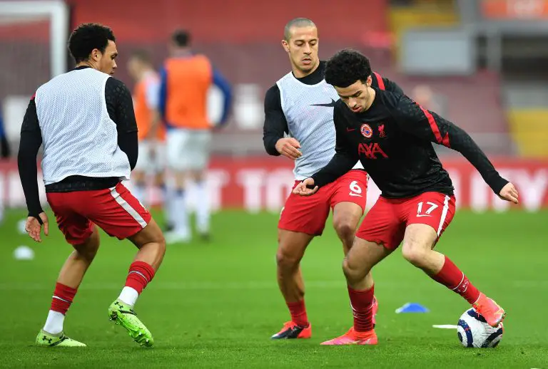 Curtis Jones, Thiago and Trent Alexander-Arnold of Liverpool warm up.