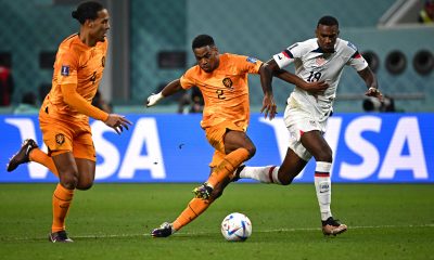 Jurrien Timber fights for the ball with USA's forward Haji Wright next to Netherlands' Virgil van Dijk.