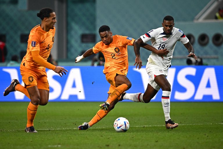 Jurrien Timber fights for the ball with USA's forward Haji Wright next to Netherlands' Virgil van Dijk.